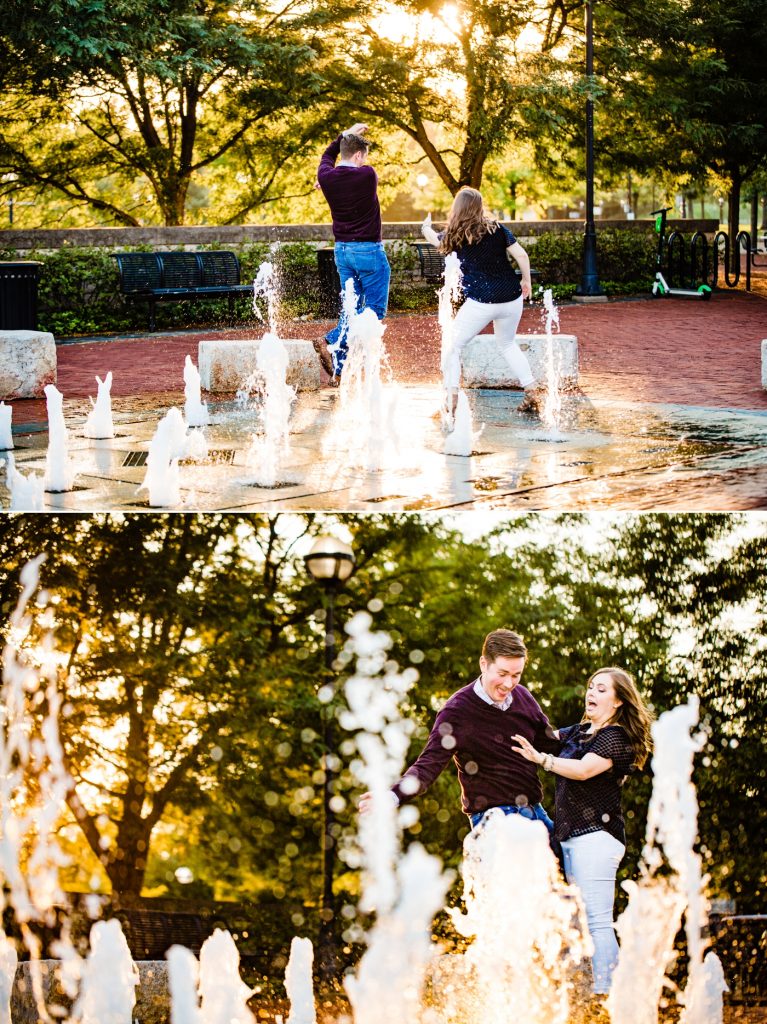 a couple playing in the water fountain at North Bank Park