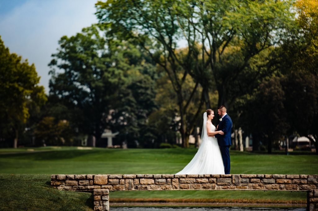 portrait of a bride and groom on the golf course before their Scioto Country Club wedding