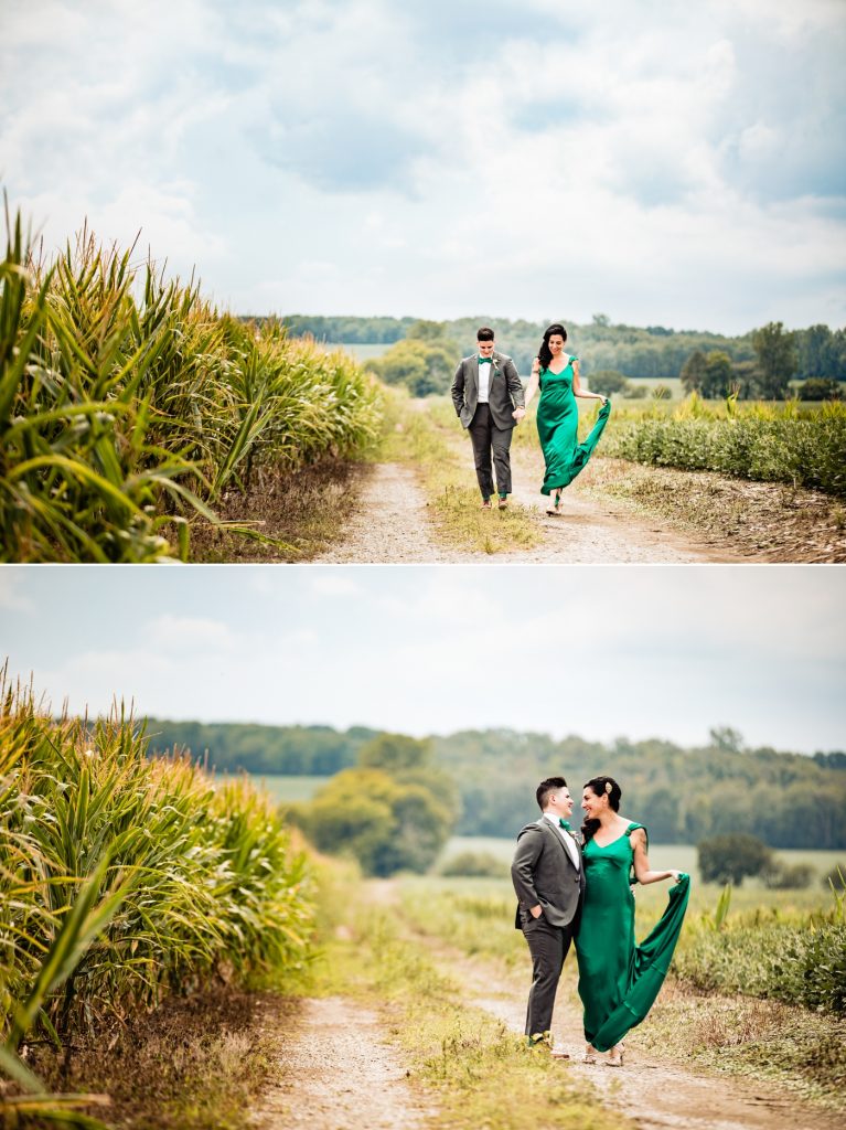 a couple walking through corn fields at their wedding at Wren Farm