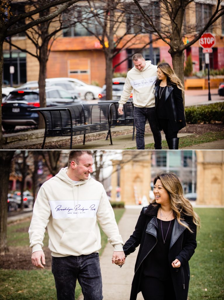 a couple walking to their engagement photos at North Market