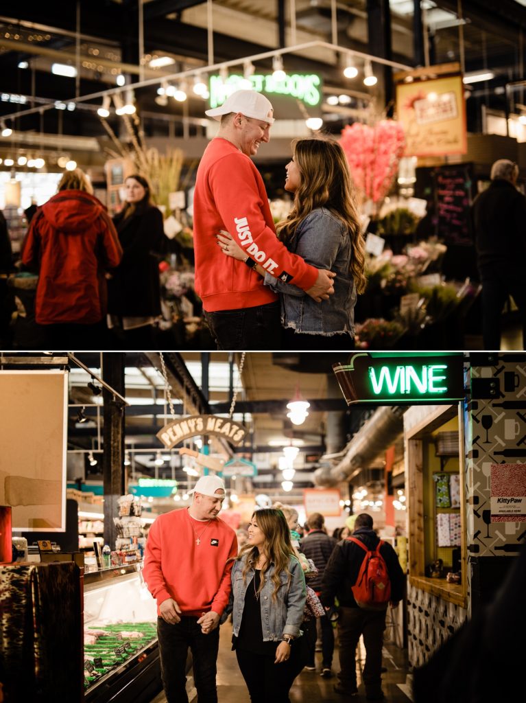 a couple walking through North Market for their engagement photos