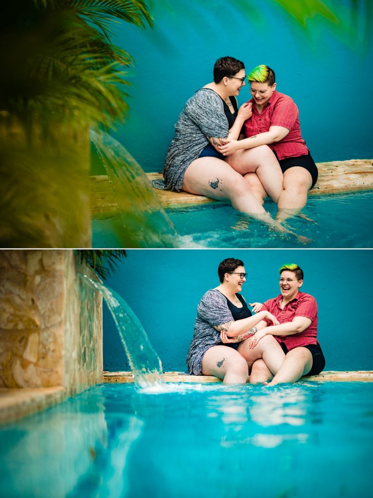 a couple dips their legs into the pool