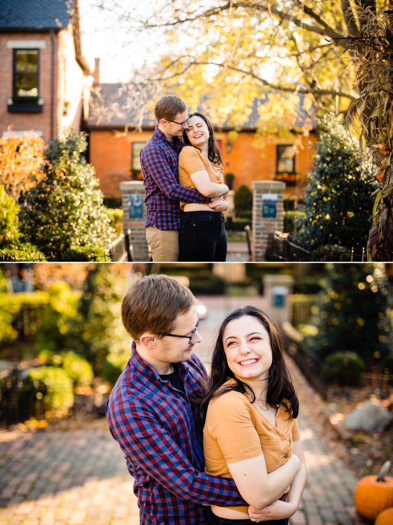 a couple cuddles and laughs at Frank Fetch Park during engagement photos in German Village