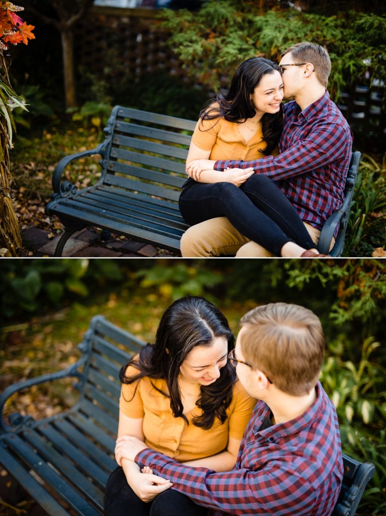 a couple sits on a bench in Frank Fetch Park during their engagement photos in German Village