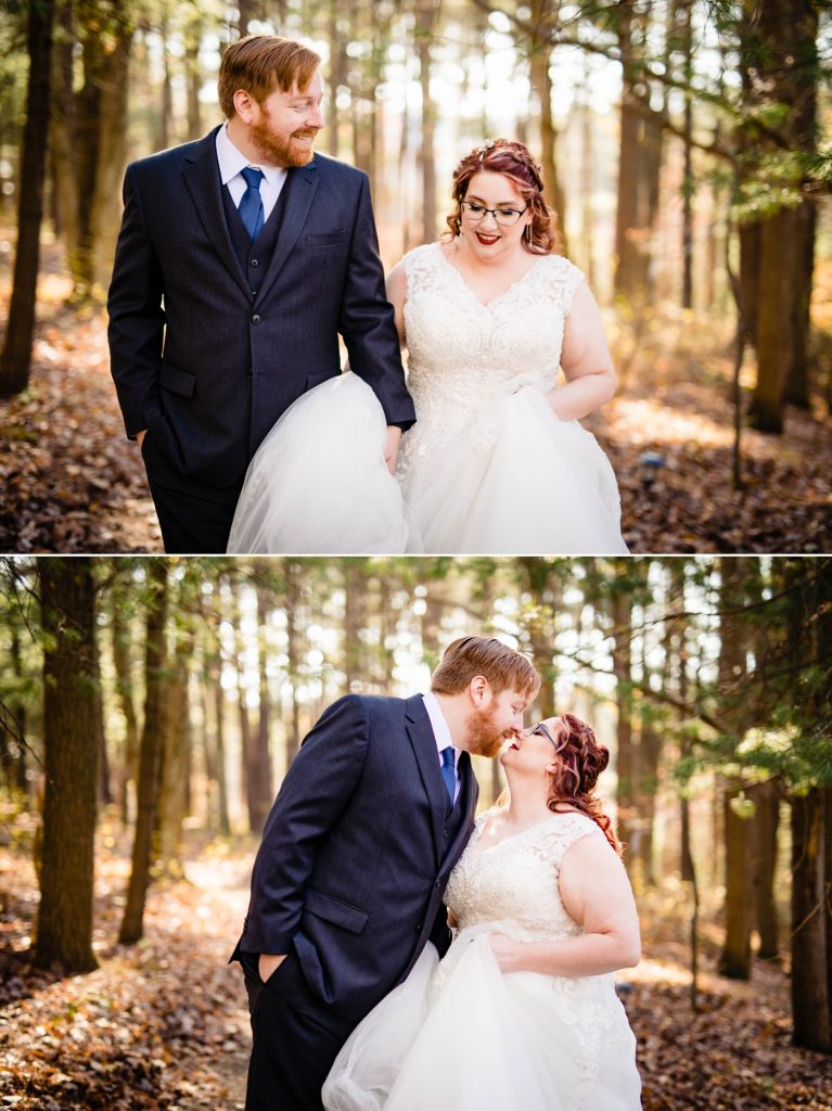 a couple walks through the woods before their wedding at the Grand Barn at the Mohicans