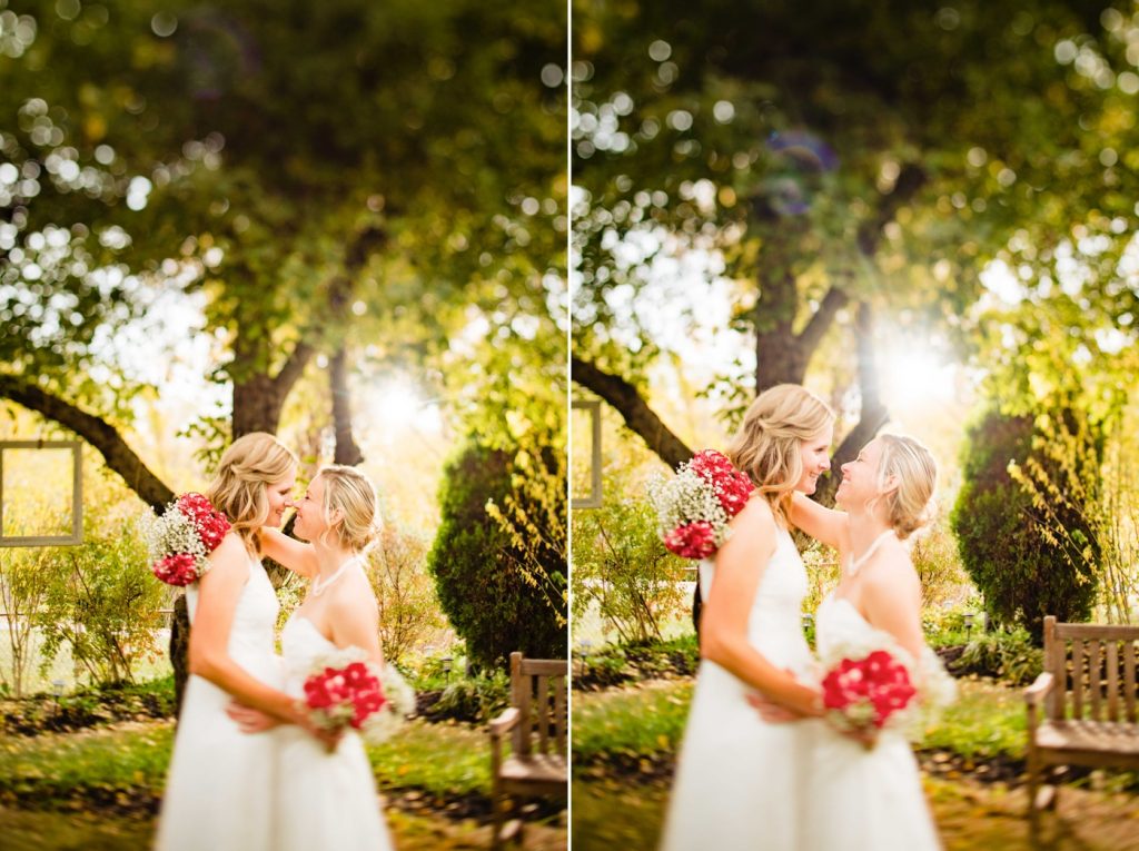 two brides hug and laugh during photos after their intimate backyard wedding