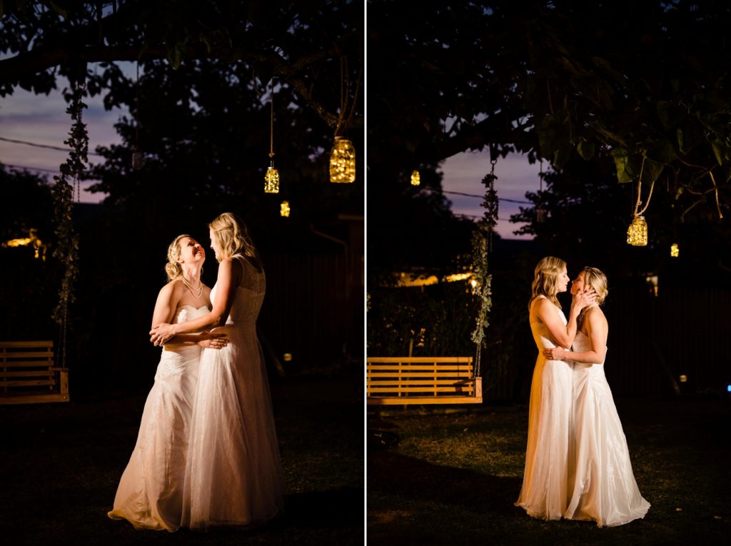 two brides dance beneath the stars at their intimate backyard wedding reception
