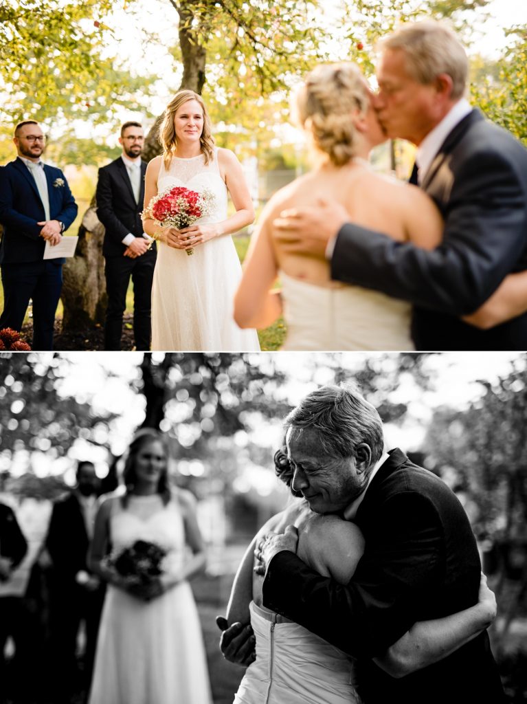 a father walks his daughter down the aisle at her intimate backyard wedding