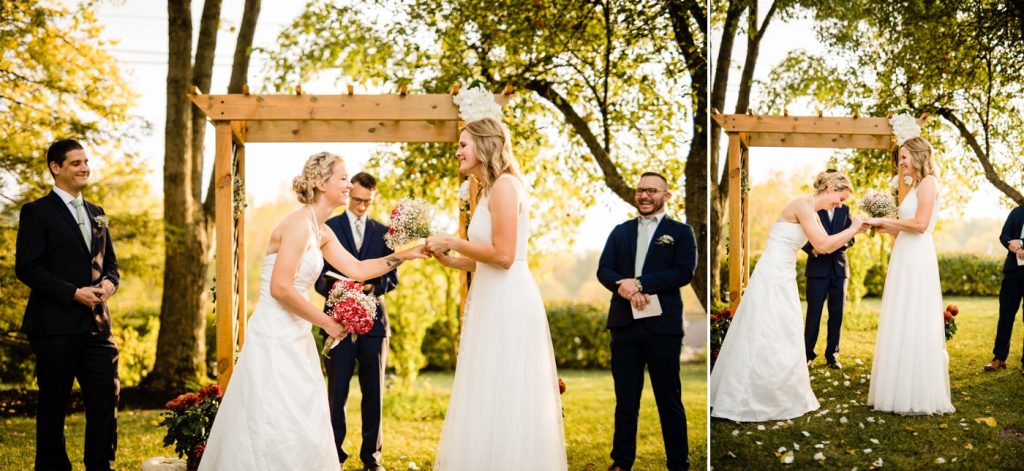 two women exchange rings during their intimate backyard wedding ceremony