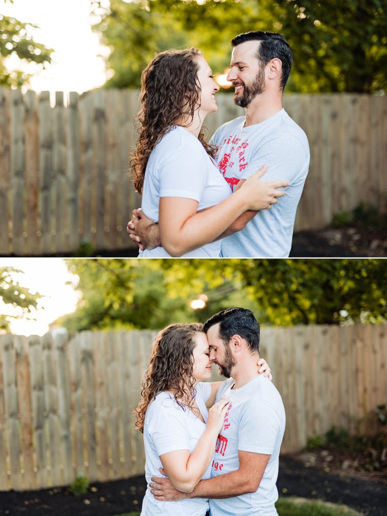 a couple cuddles in their backyard during their engagement photos in downtown Columbus