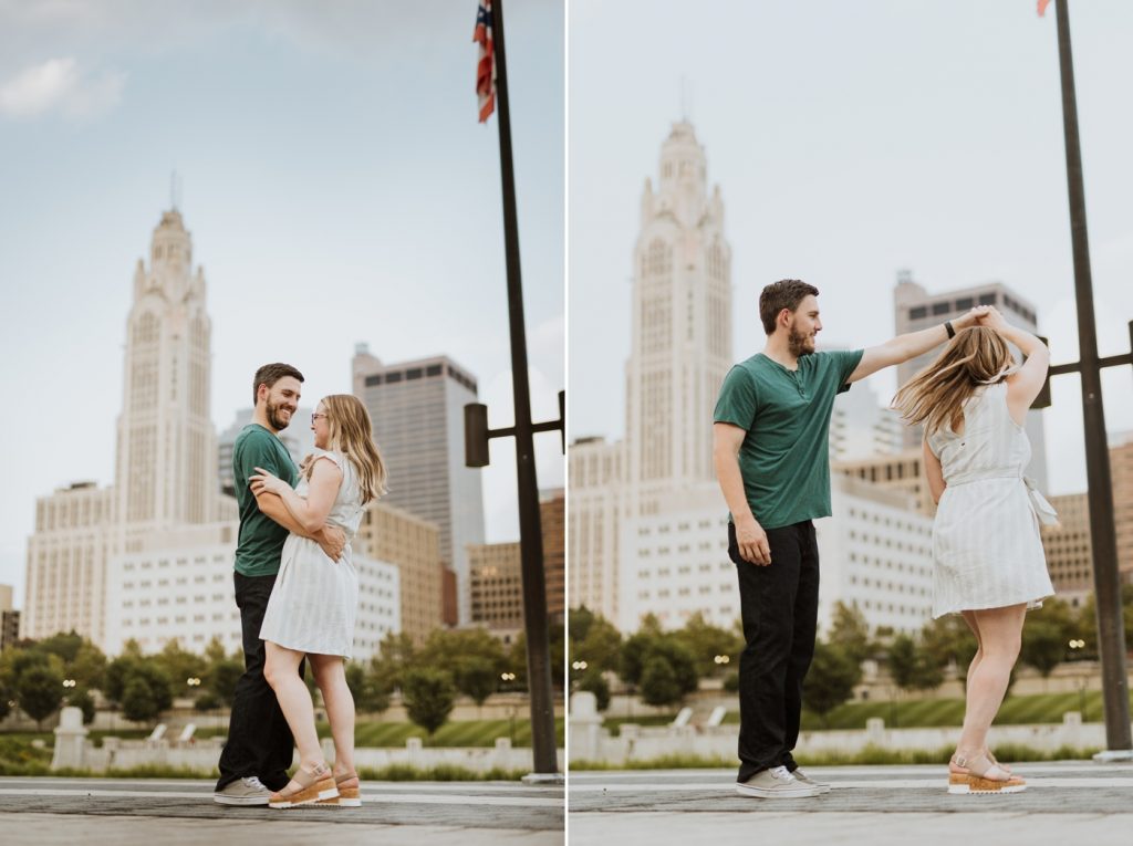 a couple slow dances in front of the skyline during their engagement photos at Genoa Park