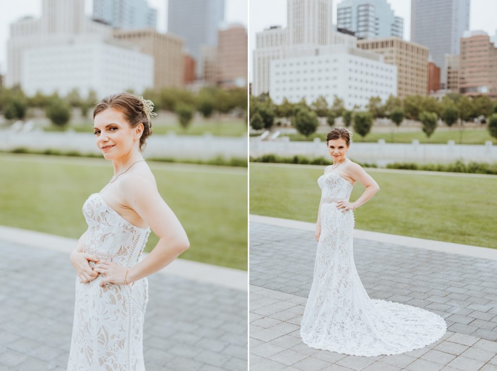 a bride poses for bridal portraits in front of the Columbus skyline at Genoa Park before her wedding at The Ivory Room