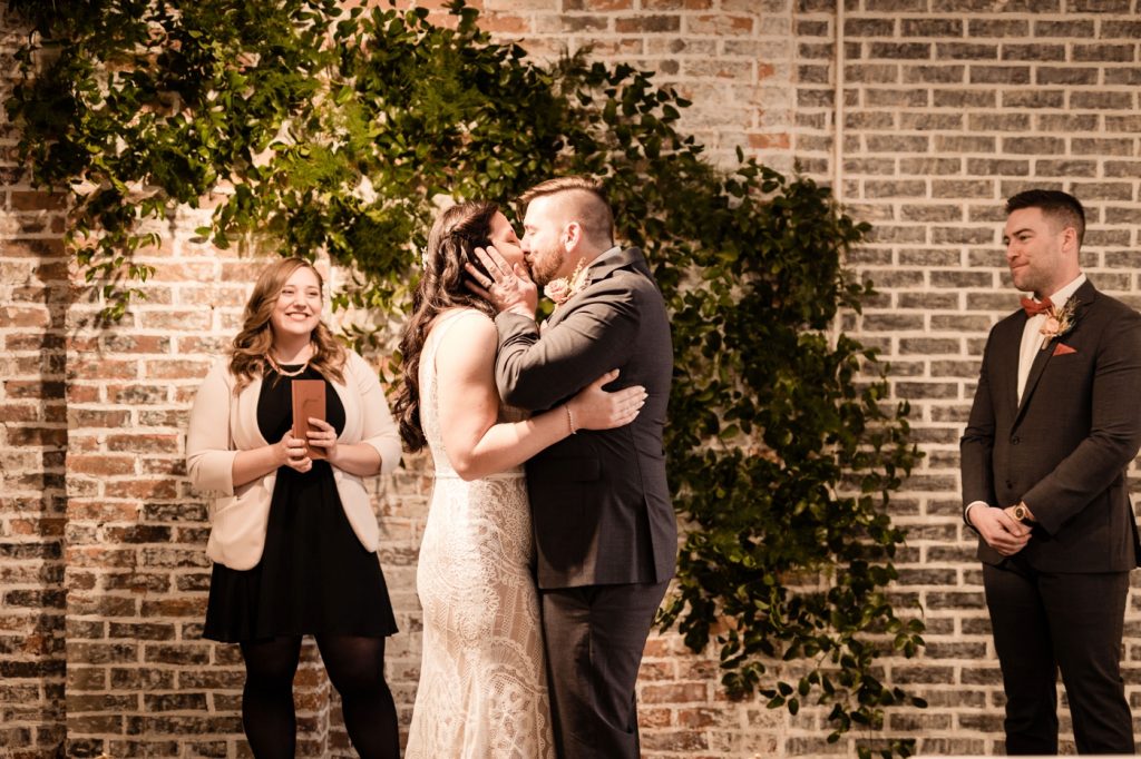 a first kiss during a wedding at The Fig Room