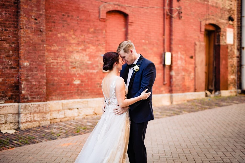 Caitlin and Jason High Line Car House Wedding - bride and groom hugging