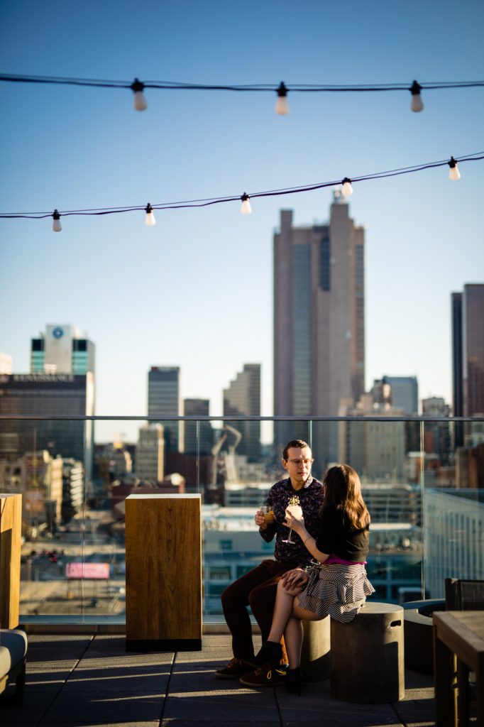 a couple on Goodale Station rooftop during engagement photos