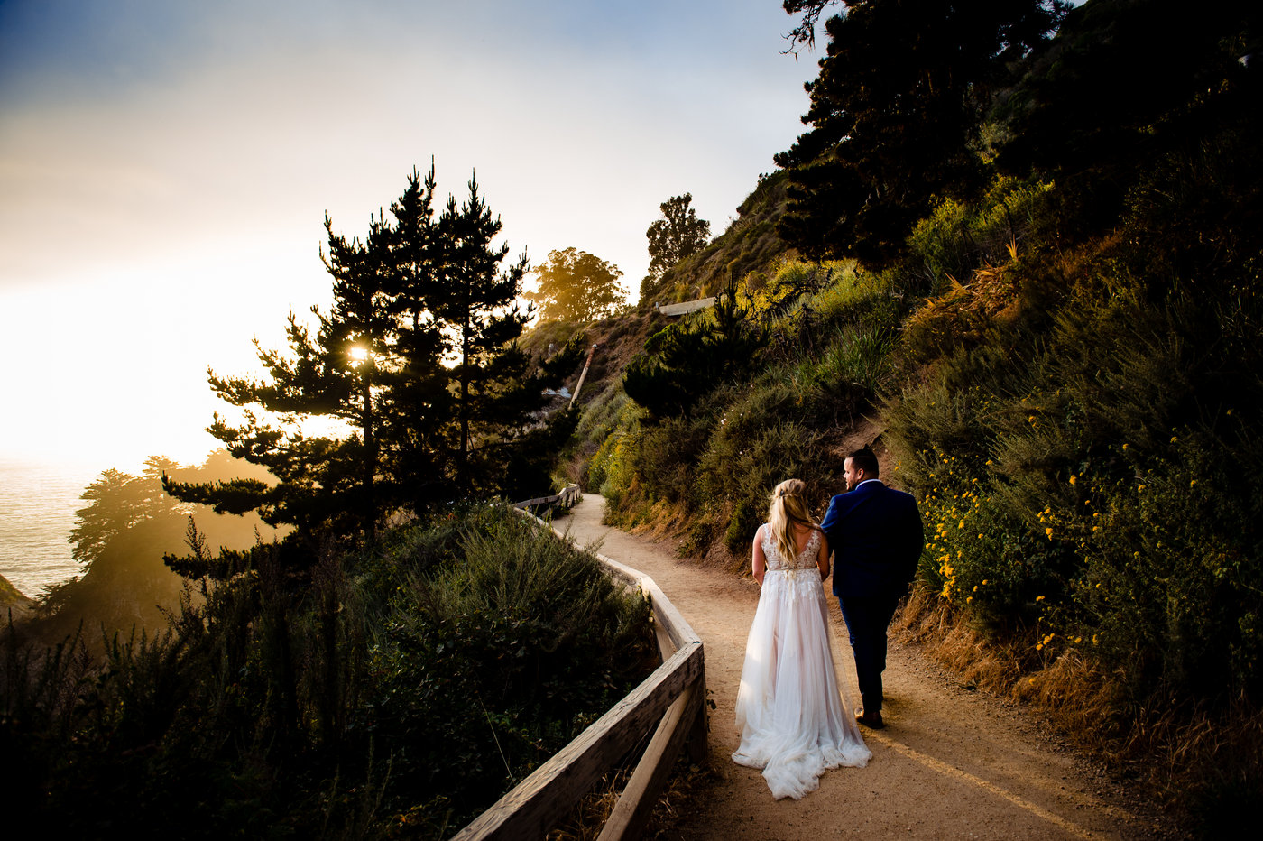 a bride and groom walking to McWay Falls in Big Sur, California