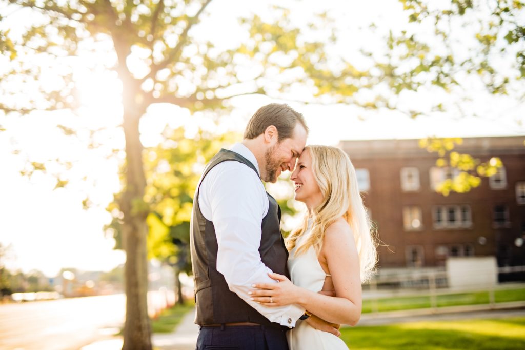 couple cuddling during their engagement session at The Bluestone