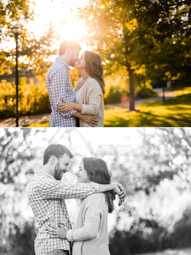 a couple kisses in front of a setting sun during their engagement session at North Bank Park