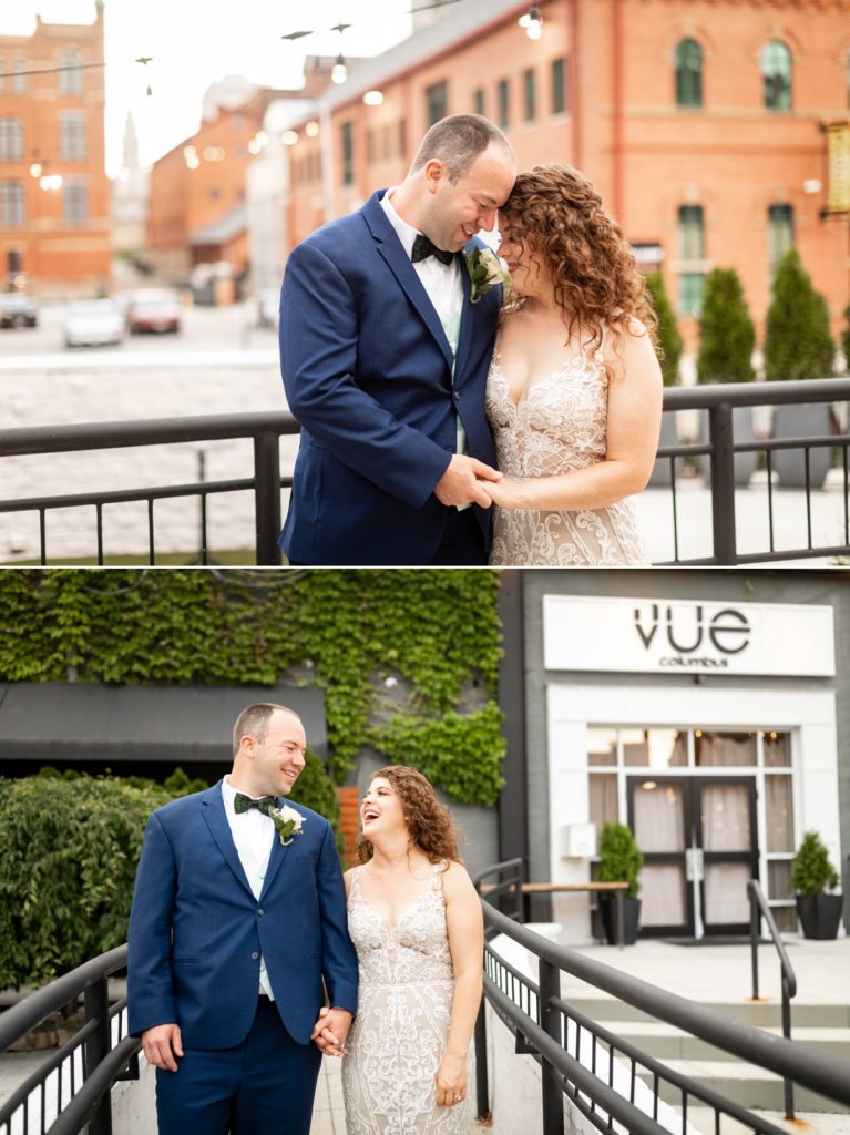 a couple takes a photo in front of their venue after their wedding at The Vue