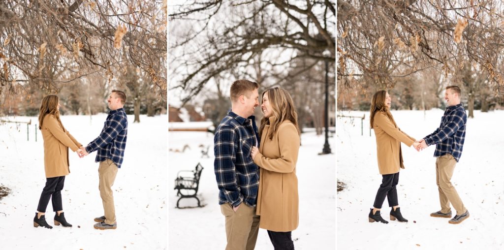 a couple gets silly during their snowy Short North engagement photos at Goodale Park