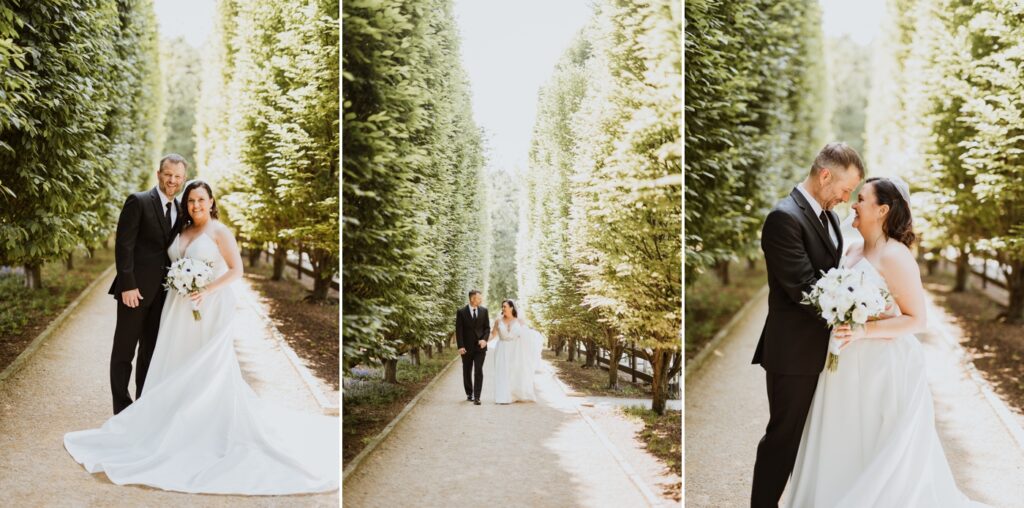 a couple walks between the evergreens before their wedding at Franklin Park Conservatory